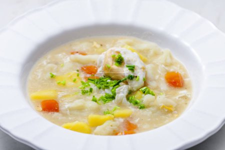 Photo for Cauliflower soup with carrot, potatoes and poache egg - Royalty Free Image