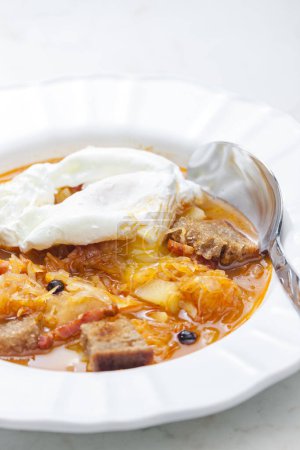 Photo for Cabbage soup with poached egg - Royalty Free Image