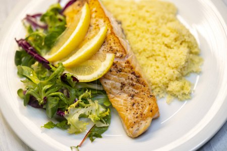Photo for Salmon fillet with couscous and vegetables salad - Royalty Free Image
