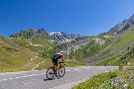 cyclist on route des Grandes Alpes near Col du Galibier, Hautes-Alpes, France