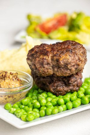 Photo for Bavarian meat loafs with peas - Royalty Free Image