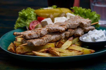 Photo for Greek souflaki with french fries - Royalty Free Image