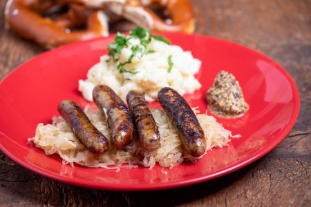 Photo for Grilled franconian sausages with sauerkraut - Royalty Free Image