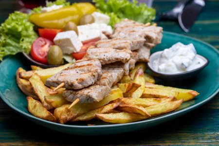 Photo for Greek souflaki with french fries - Royalty Free Image
