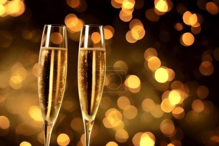 Photo for Two glasses of champagne toasting with bokeh balls or fireworks going off in the background - Royalty Free Image