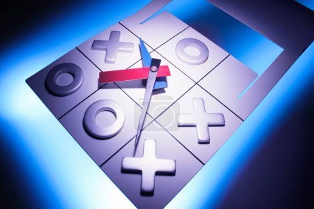 Photo for Tic tac toe; tic-tac-toe; game; noughts; crosses; outsmart; challenge; match; competition; rivalry; strategy; recreation; leisure; activity; pastime; clock hands; time; timing; timely; precise; precisely; precision; deadline; urgency; pressure; accur - Royalty Free Image