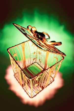 Photo for Metal Gift Box on Green Background - Royalty Free Image