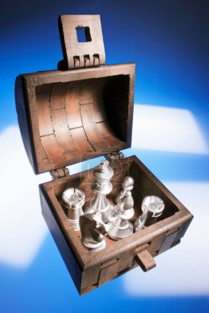 Photo for Chess Pieces in Wooden Chest - Royalty Free Image