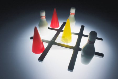 Photo for Tic Tac Toe with Miniature Bowling Pins and Game Pieces - Royalty Free Image
