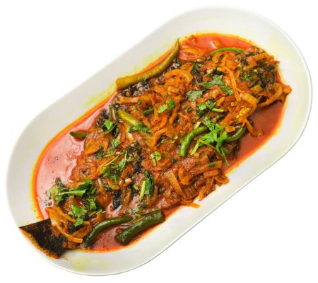 Foto de Pez plano cocido en un plato de estilo indio caliente - Imagen libre de derechos