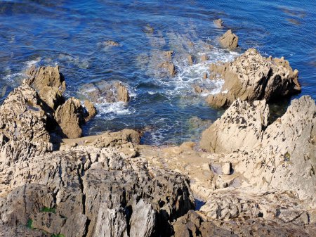 Photo for Rocky coastline of Saint-Mathieu is a headland located near Le Conquet in the territory of the commune of Plougonvelin in department of Finistre in France - Royalty Free Image