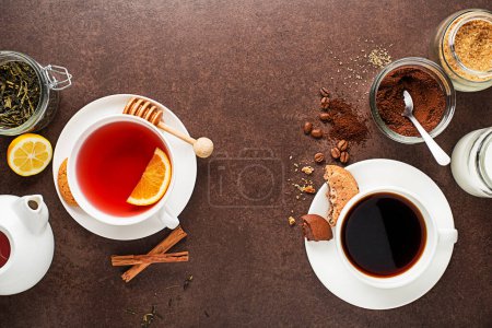 Photo for Cups of hot coffee and tea with ingredients on dark background - Royalty Free Image