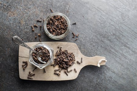 Cloves spice. Some dried cloves on grey rustic style background spice concept