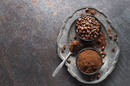 Photo for Coffee beans and freshly ground coffee powder on stone background. Top view with copy space for your text - Royalty Free Image