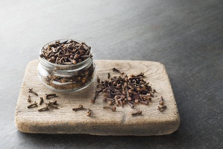 Photo for Cloves spice. Some dried cloves on grey background spice concept - Royalty Free Image