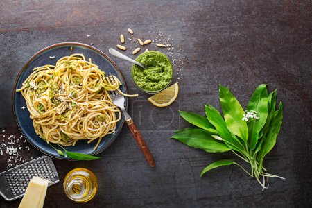 Photo for Making Fresh pasta with ramson or wild garlic pesto. Healthy spring food concept - Royalty Free Image