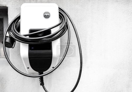 A charger for electric cars on a house wall
