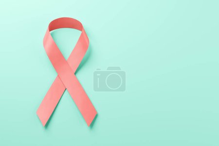 Photo for Symbol Pink ribbon on blue background. Day against breast cancer. Breast cancer awareness. - Royalty Free Image