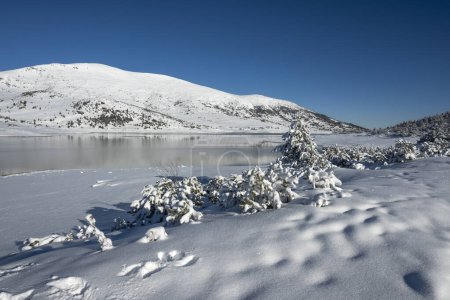 Amazing winter view of Belmeken Dam at Rila mountain, Bulgaria