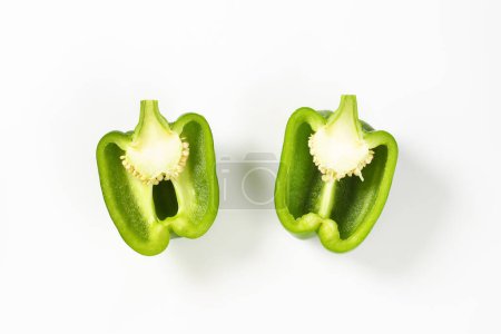 Photo for Fresh green bell pepper cut into halves - Royalty Free Image