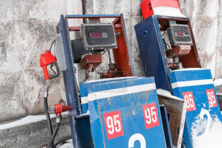 Two aged gas dispensers. Abandoned fuel pumps. Energy or gas crisis concept