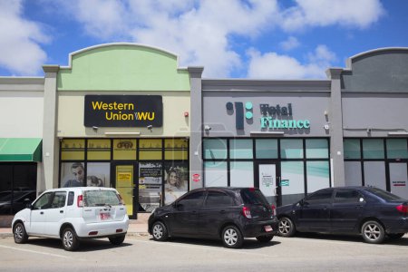 Photo for ORANJESTAD, ARUBA - JULY 17, 2022: Western Union and Total Finance offices in Rutena Mall along Adriaan Lacle Blvd in Oranjestad on the Caribbean island of Aruba - Royalty Free Image