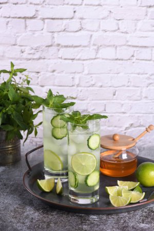 Photo for Cucumber Gimlet with gin and honey, very good in combination with mint. This is a great refreshing cocktail. - Royalty Free Image