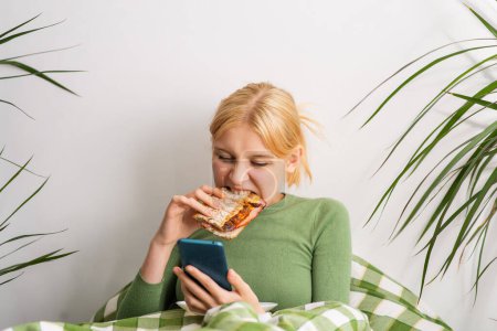 In bed all day, a girl undergoes emotional decay, her hours passing with a phone in hand and bites of toast in her mouth. Bed rotting
