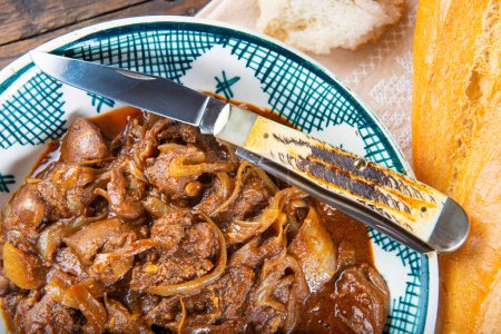 Photo for Chicken liver with onions with breath on the table - Royalty Free Image
