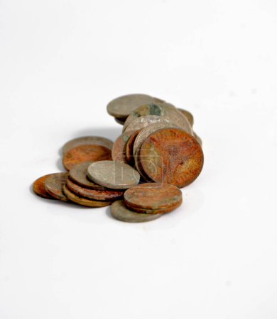 A pile of tarnished and partially corroded coins.
