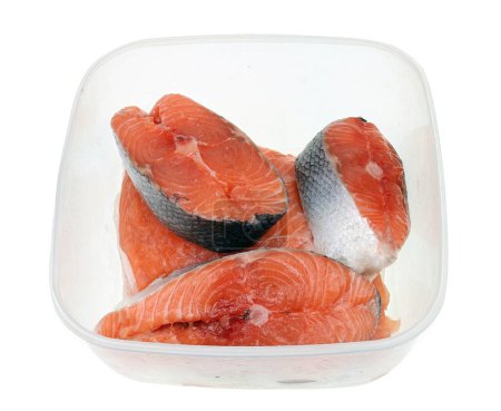 Photo for Raw salmon steaks in a plastic box. Isolated - Royalty Free Image