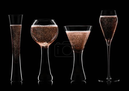 Photo for Set of pink rose wine and champagne glasses on black.Balloon shape,flute and prosecco glasses. - Royalty Free Image