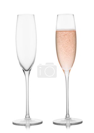Photo for Empty and full original glassess of pink rose champagne on white. - Royalty Free Image