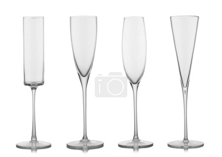 Set of various empty luxury crystal handmade champagne glasses on white.