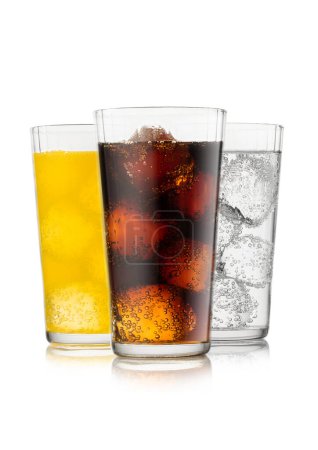 Cola soda drink with lemonade and orange soda with ice cubes and bubbles on white background.