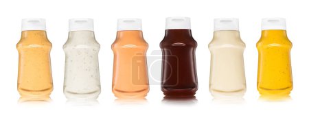 Photo for Various sauces in plastic bottles on white.Burger,garlic,mayo,barbecue and mustard sauce - Royalty Free Image