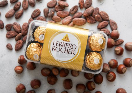 Photo for LONDON, UK - MARCH 10, 2024: Box of Ferrero Rocher chocolate candies with cocoa and hazelnut nuts. - Royalty Free Image