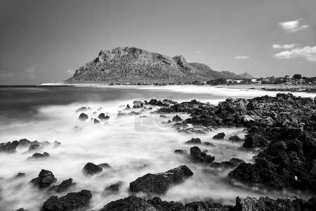 Sea, beach and mountains in the town of Stavros on the island of Crete, Greece,  monochrome