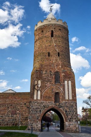 medieval fortifications with a brick tower and a stone wall in Prenzlau, Germany