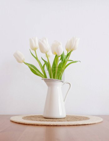Photo for Beautiful bouquet of white tulips in white vase on a light background - Royalty Free Image