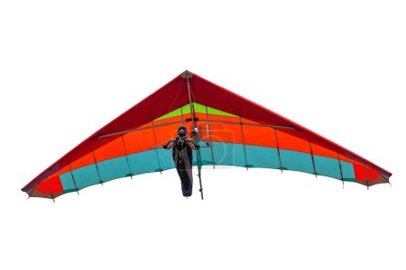 Foto de Ala planeador colgante colorido aislado en blanco. Chica piloto se eleva en su ala en el cielo - Imagen libre de derechos