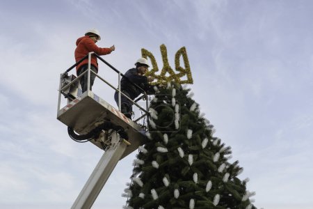 Photo for 2023-12-05 Kyiv, Ukraine. Christmas tree decoration works during the fullscal russian invasion of Ukraine. - Royalty Free Image