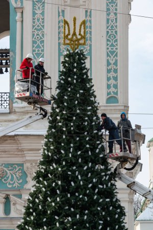 Photo for 2023-12-05 Kyiv, Ukraine. Decoration of Christmas tree donated to the city by patrones. - Royalty Free Image