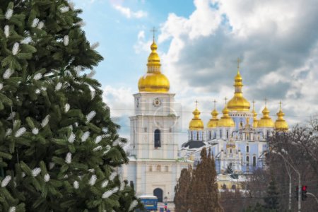 Photo for Kyiv Chrismas view. Golden belltower of Mikhailivskyi monastery and decorated Christmas tree. Selective focus on tree - Royalty Free Image