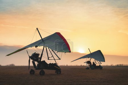 Photo for Hang glider trikes on the runway ready for adventure. Artistic aviation photo - Royalty Free Image