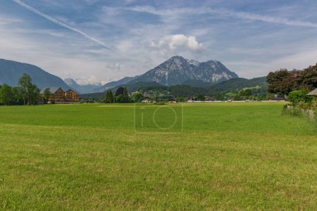 Photo for Picturesque green alpine meadow surrounded by mountain peaks. Green alpine pasture. Loser and Altaussee lake with Dachstein plateau on the background. Austrian landscape - Royalty Free Image