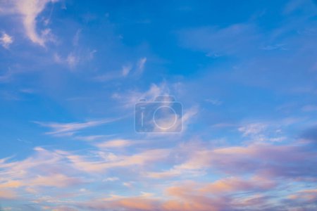 Beatiful sunset sky with pink cirrus clouds background. 