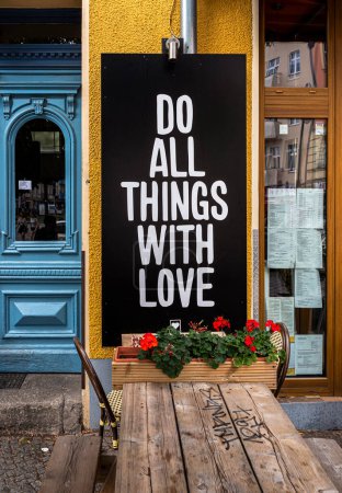 Photo for Chalkboard with slogan on restaurant, Prenzlauer Berg, Berlin, Germany - Royalty Free Image