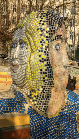 Mosaic faces, children's playground, Berlin, Germany