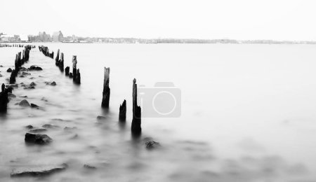Long exposure, groynes and wooden stakes in the Baltic Sea, Rgen, Mecklenburg-Western Pomerania, Germany